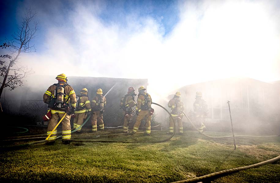 OCFA firefighters putting out a fire