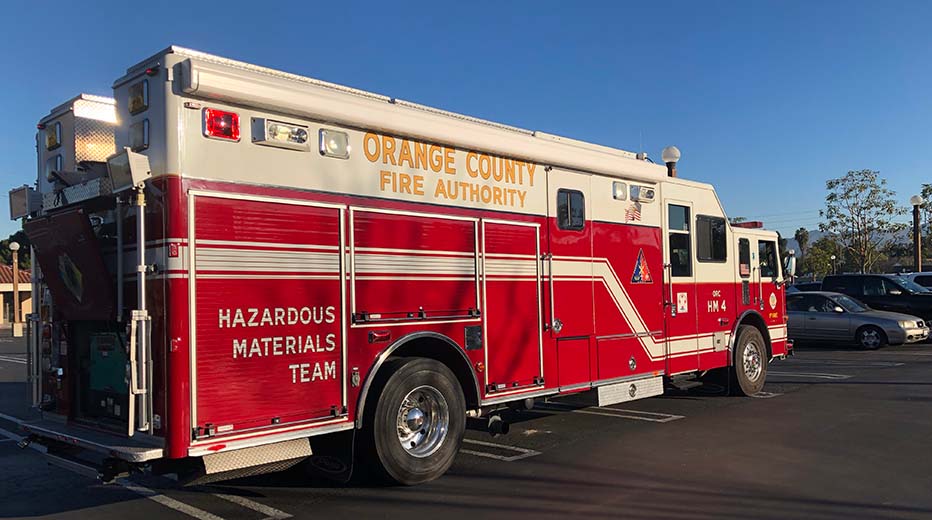 hero_hazmat Airport rescue trucks parked in front of a station