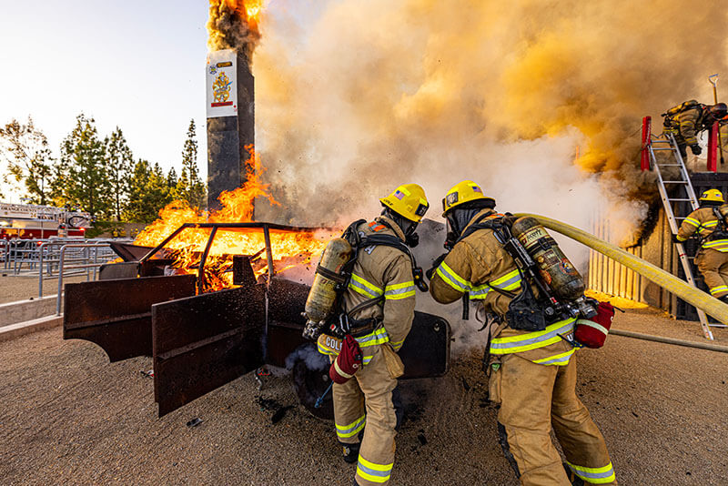 Firefighters putting out a vehicle fire demonstration