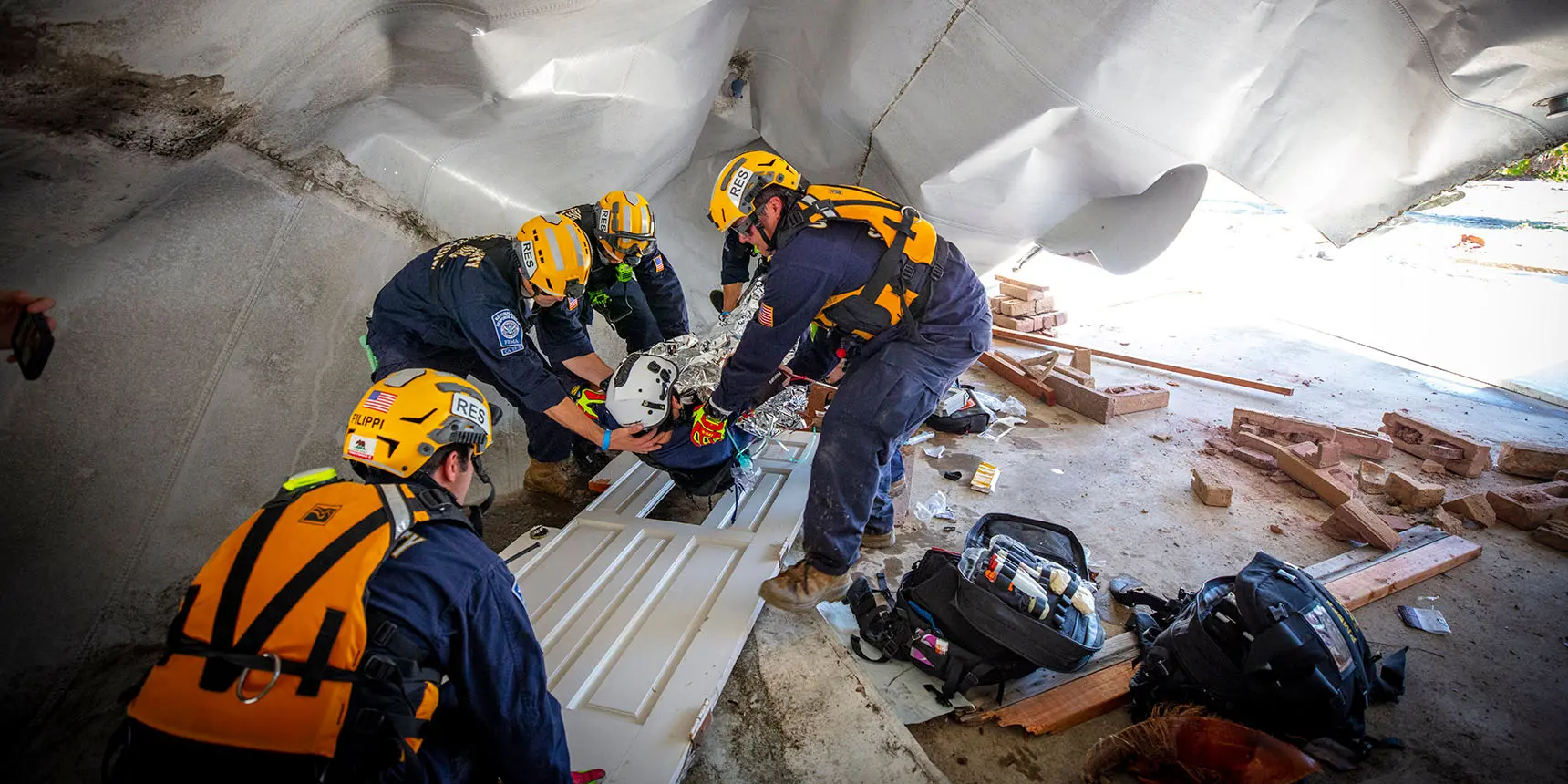 Airport rescue trucks parked in front of a station