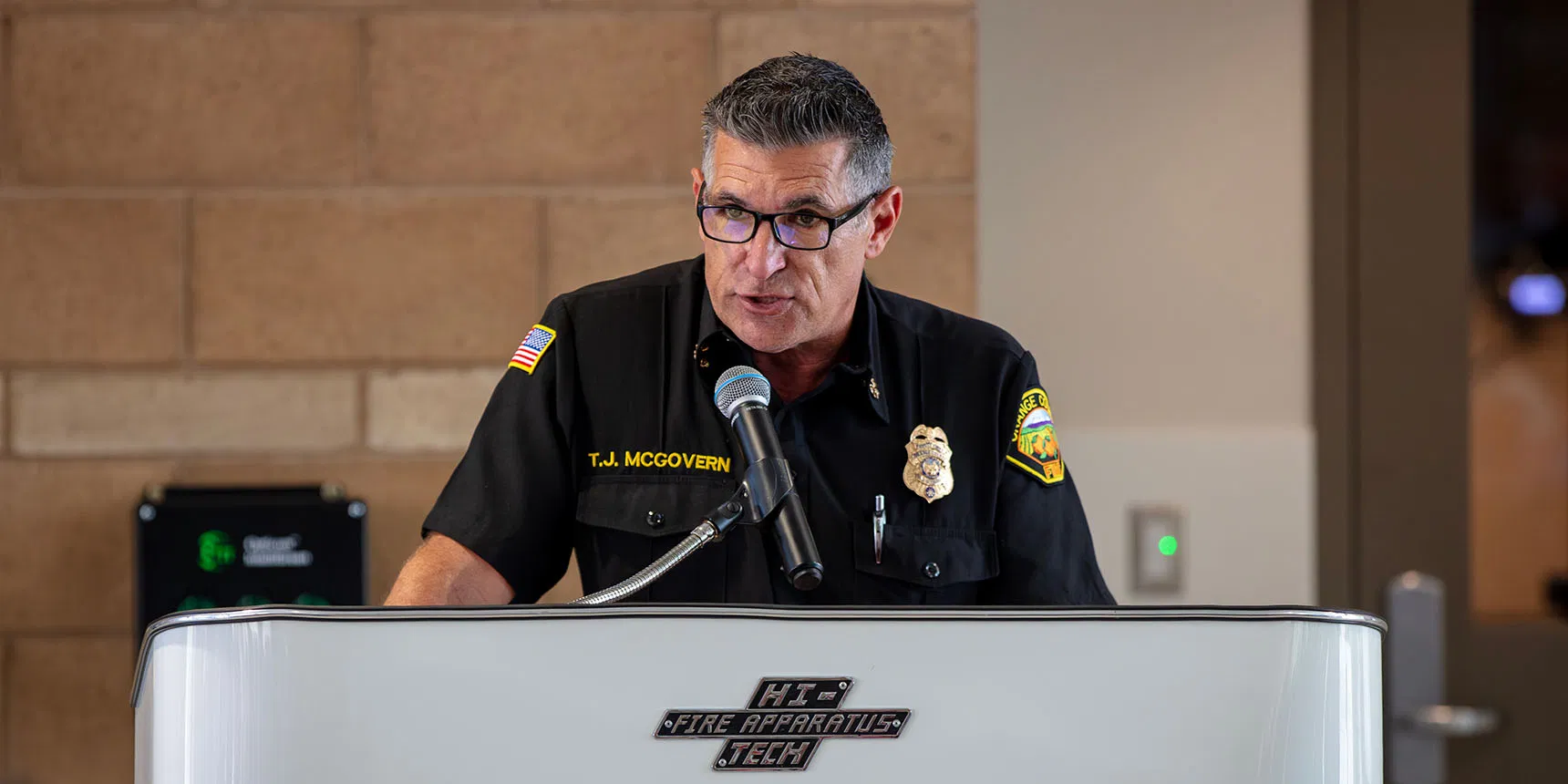 Acting Fire Chief TJ McGovern speaking at a podium